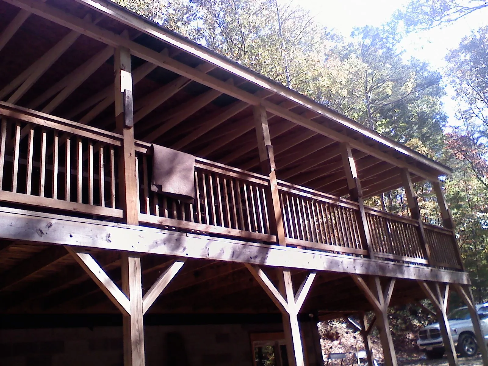 Timber framing under a new elevated porch and deck — Roof Leak Repair in Milano by Roofing Brothers
